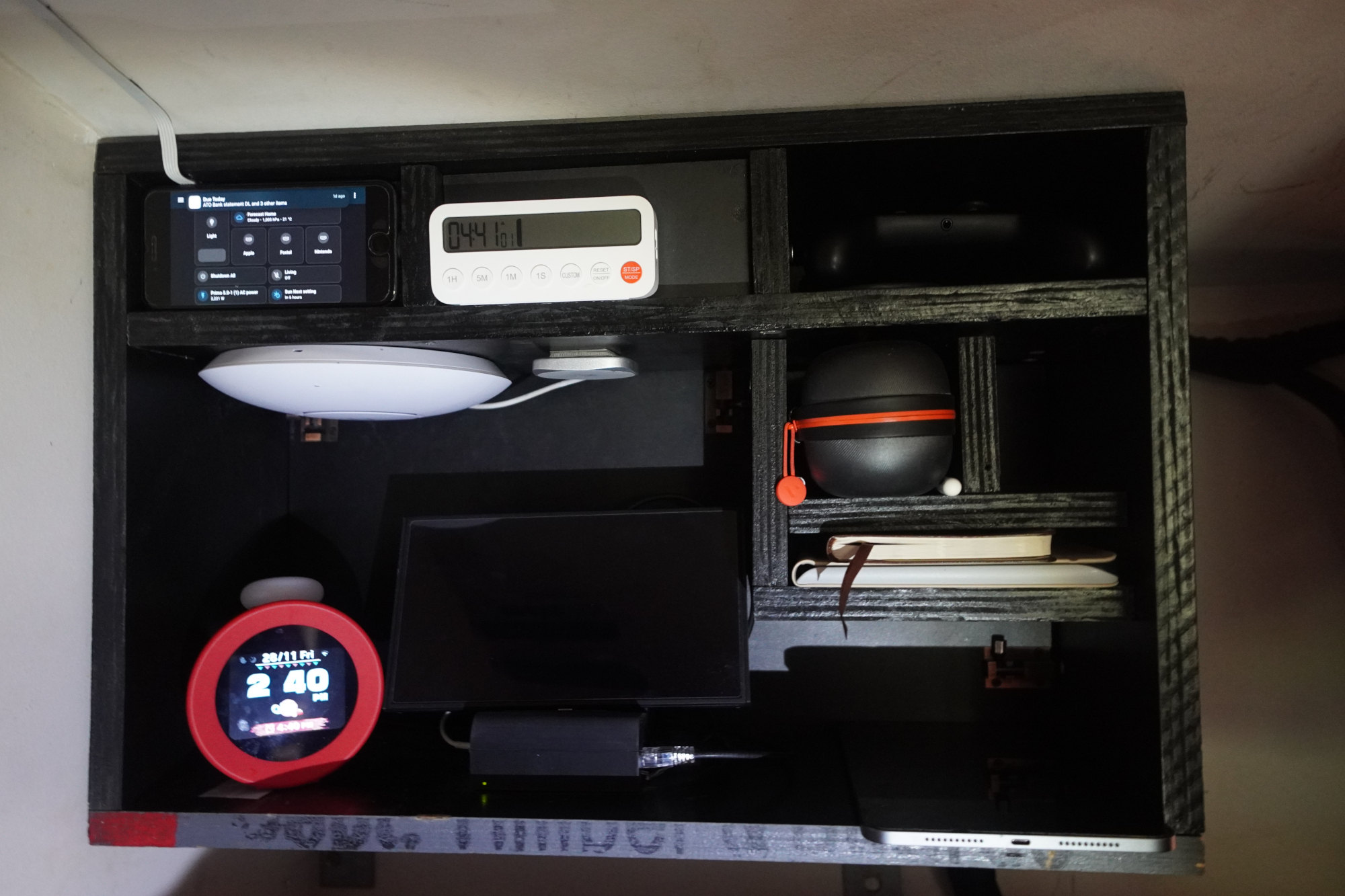 Closeup of bedside AV shelf